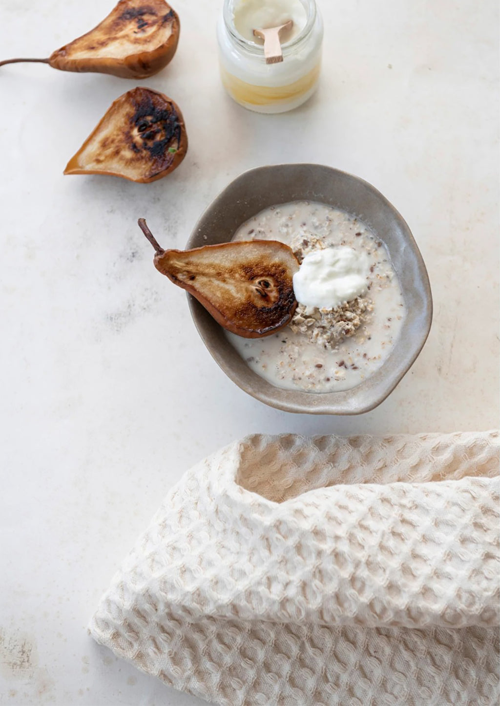 Chalk: A cream waffle weave dish towel as part of a breakfast kitchen scene.
