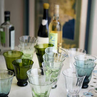 1: Footed Water glasses in assorted colors.