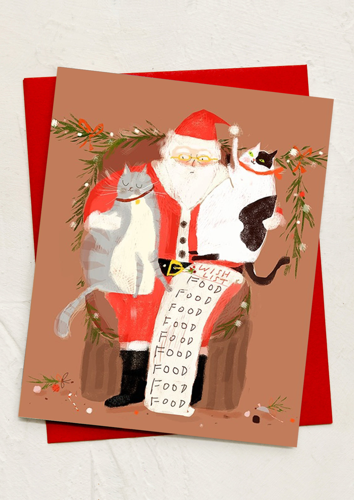 An illustrated greeting card with cats sitting with santa claus.