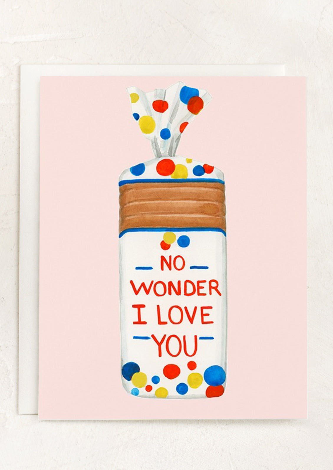 A pink greeting card with illustration of loaf of wonder bread, text reads "No wonder I love you".