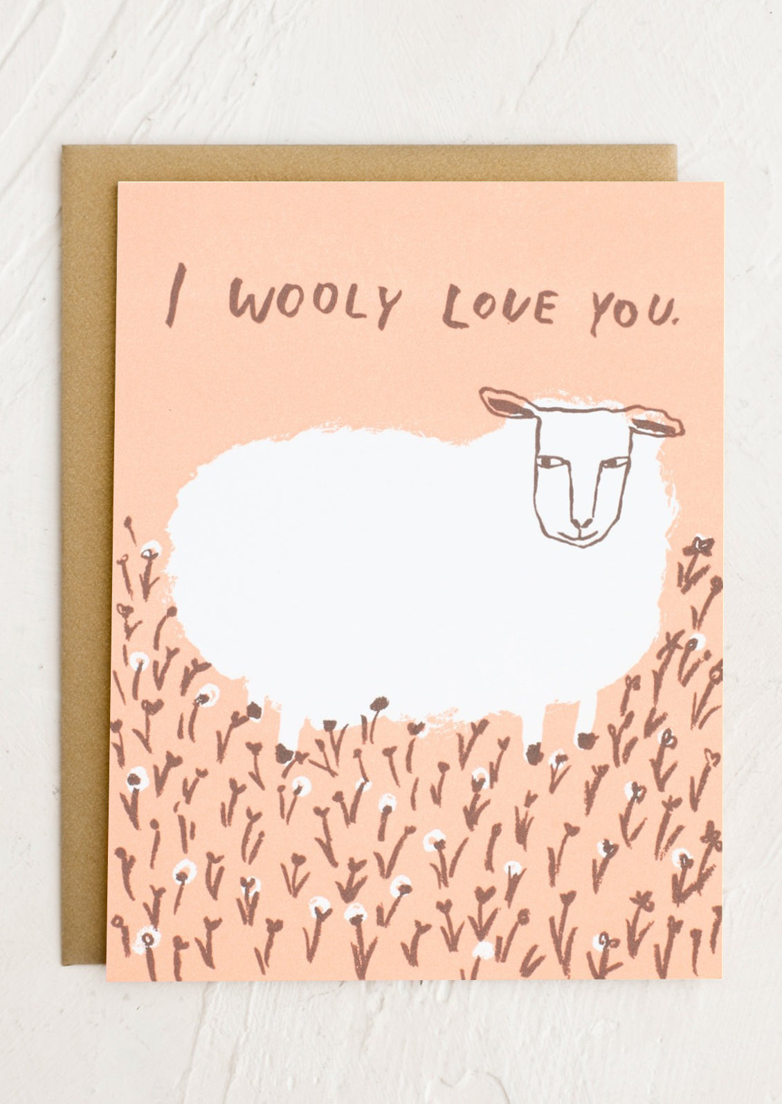 A card with image of sheep, text reads "I wooly love you".