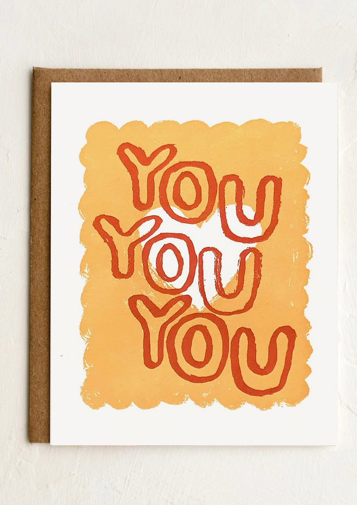 1: A card with scalloped background reading "you You You".