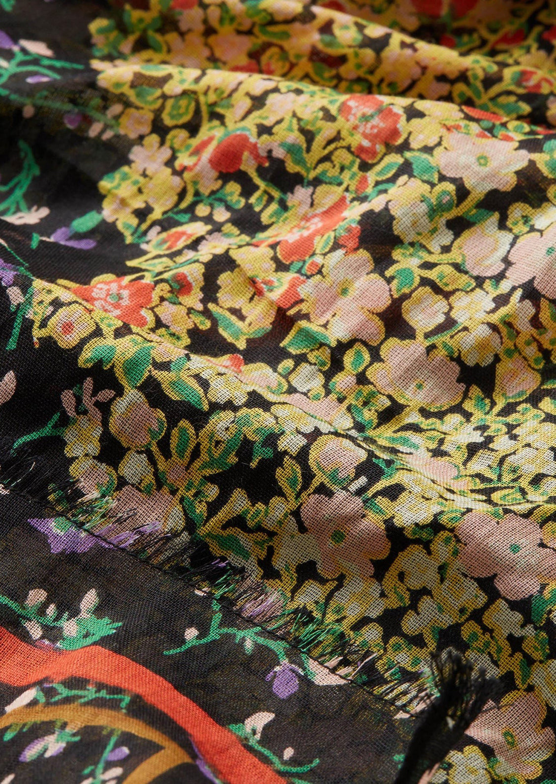 A cotton scarf with black multicolor floral print.