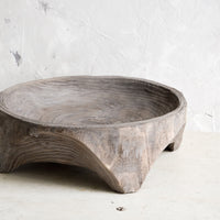 2: Round, primitive style shallow wooden display bowl with chunky footed base