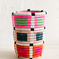 Brights Multi: Pencil cup shaped basket woven from multicolor sweetgrass. Mix of bright colors in a geometric pattern.