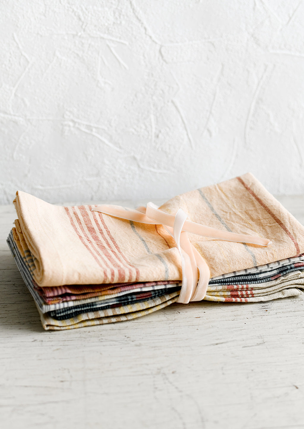 3: A set of napkins bound with velvet ribbon.