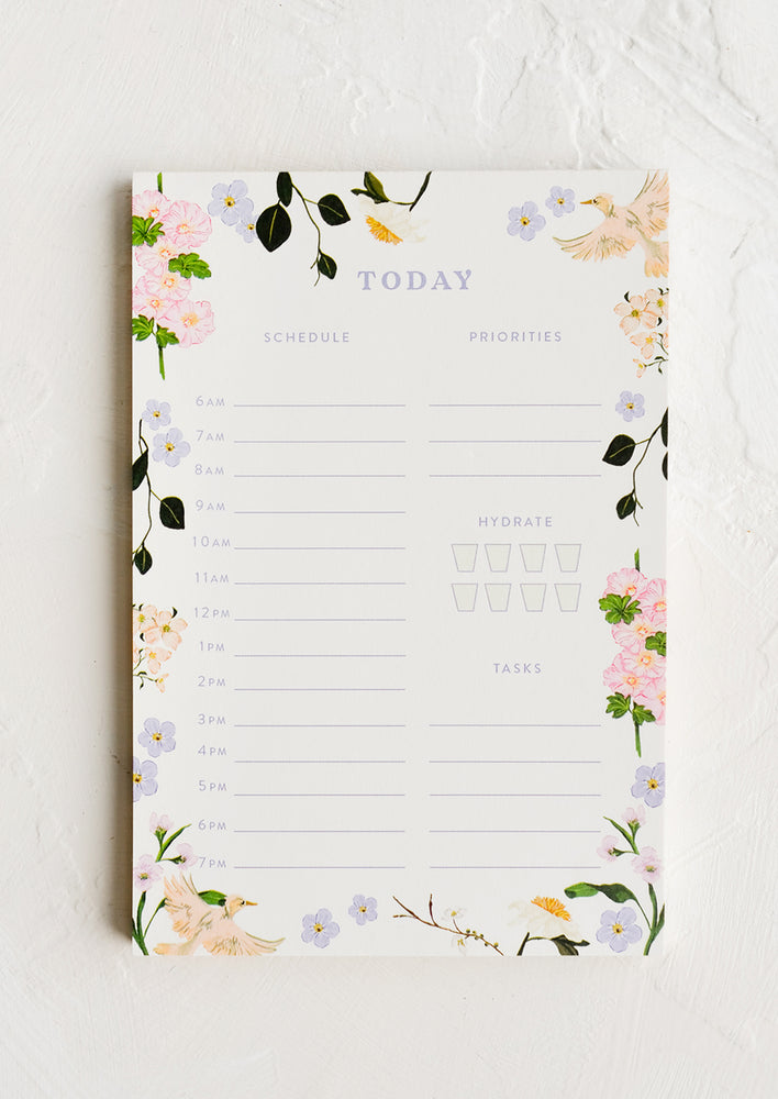 1: A task notepad with floral aviary border.