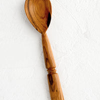 2: A hand carved spoon with inset "band" detailing on handle.