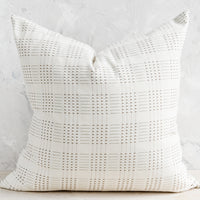1: A natural cotton throw pillow with embroidered basketweave pattern in brown.