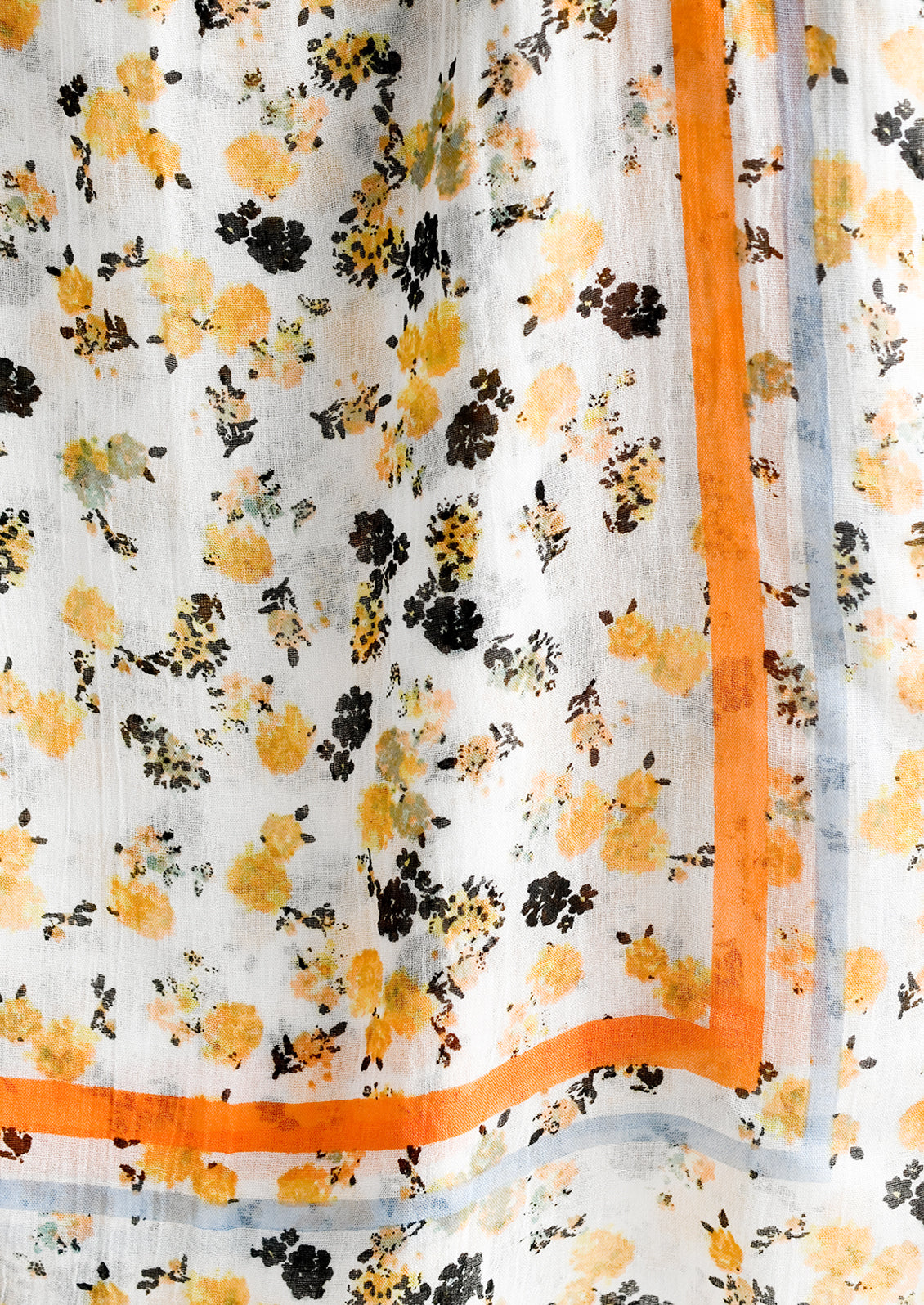 A floral print scarf with orange and blue border.