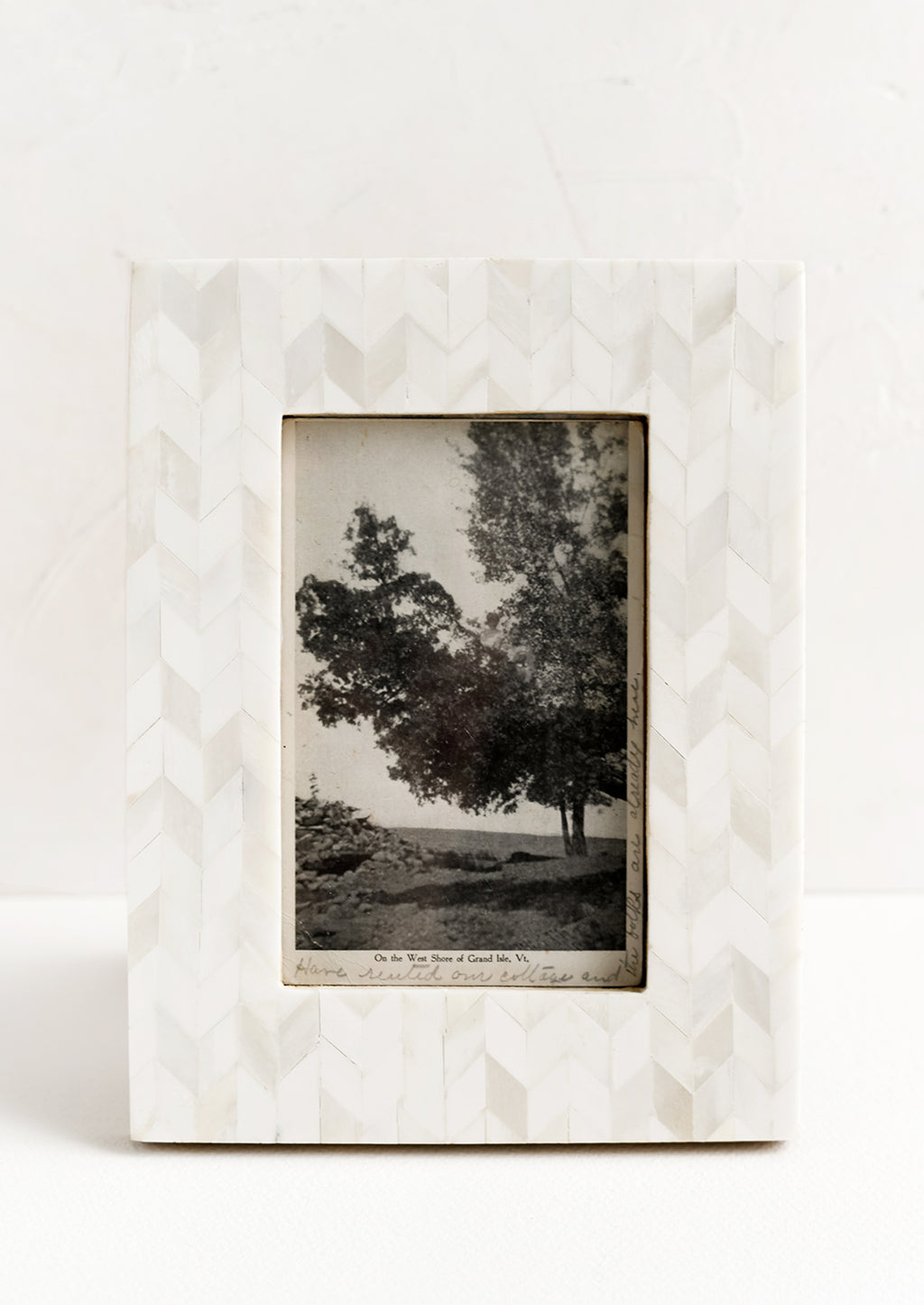 1: A picture frame in chevron pattern made from ivory bone.