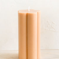 Nude: A flower shaped pillar candle in nude peach color.