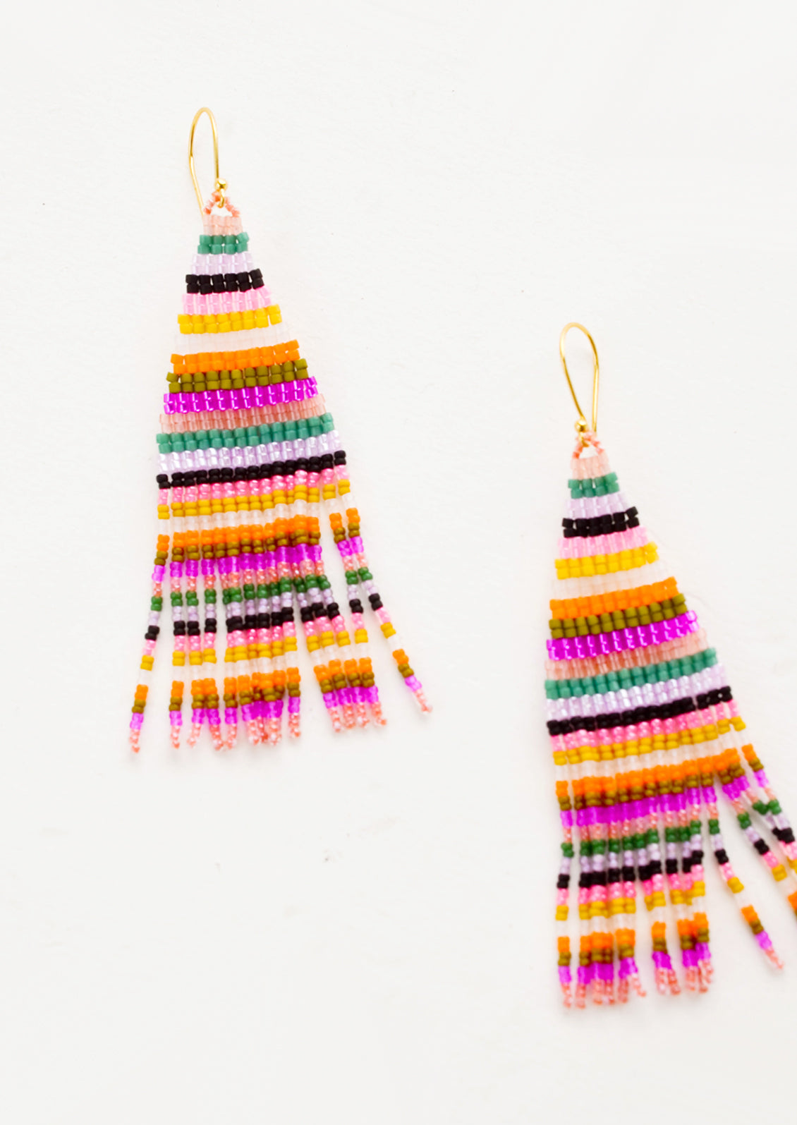 Earrings made from colorful glass beads in horizontal stripes, with triangular top and fringed bottom, colorful