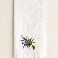 Lavender: A white cotton napkin with lavender embroidery.