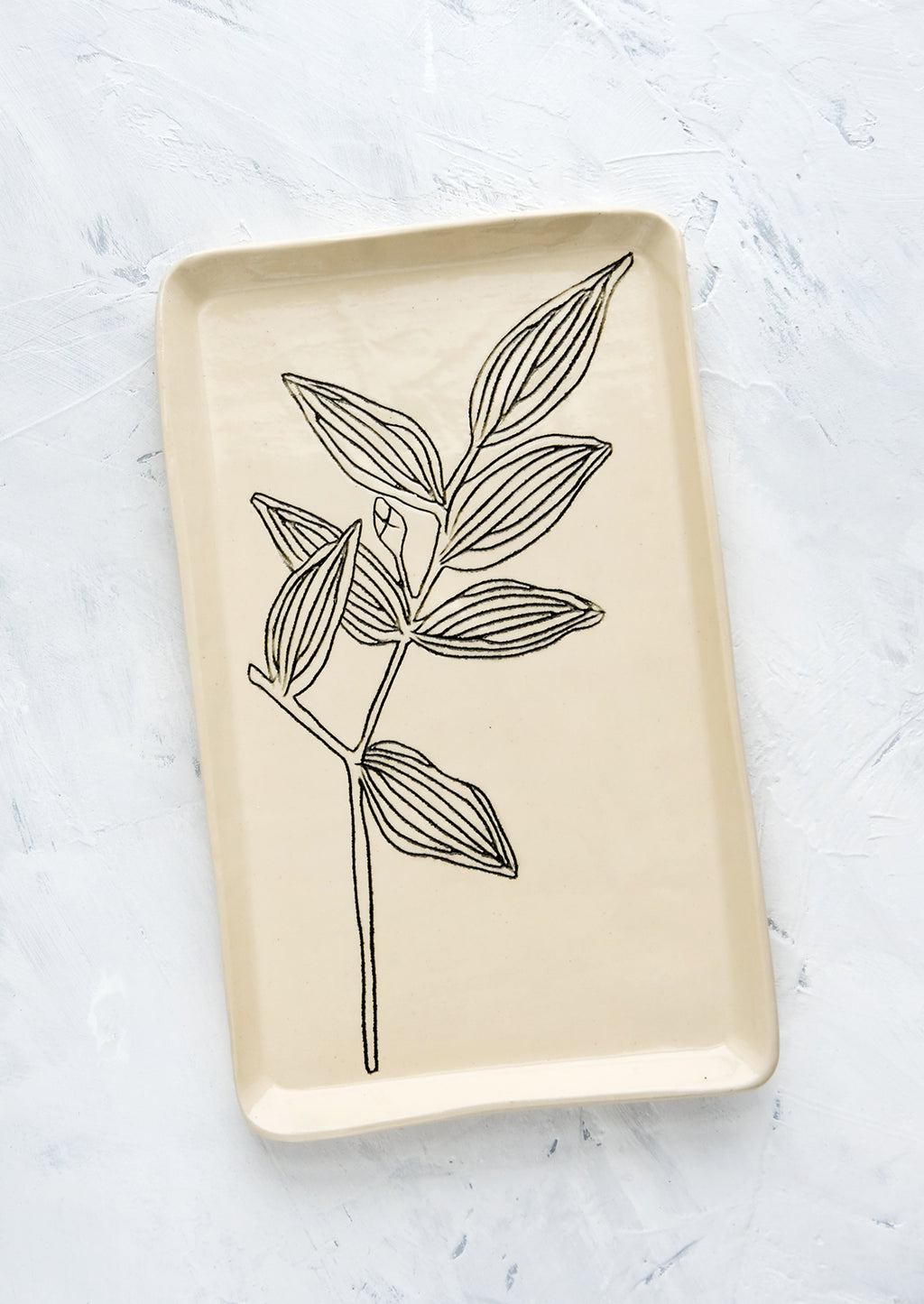 Bellwort: A rectangular ceramic tray in natural bisque color with an etched black drawing of Bellwort plant.