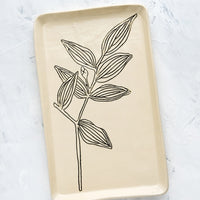 Bellwort: A rectangular ceramic tray in natural bisque color with an etched black drawing of Bellwort plant.