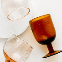 1: Rose and amber colored stemware glasses.