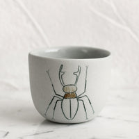 Extra Small / Beetle / Grey: An extra small grey porcelain cup with beetle sketch.