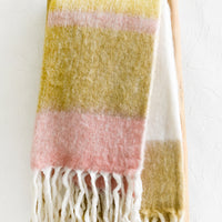 White Multi: A striped mohair throw blanket in tones of yellow and pink.