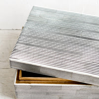 4: A large lidded storage box made from black & white striped bone.