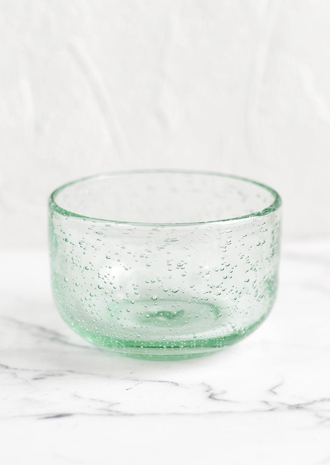 A small recycled glass bowl in clear glass color.