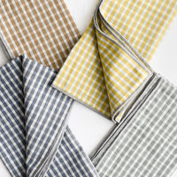 1: A set of four plaid print napkins in a mix of colors.