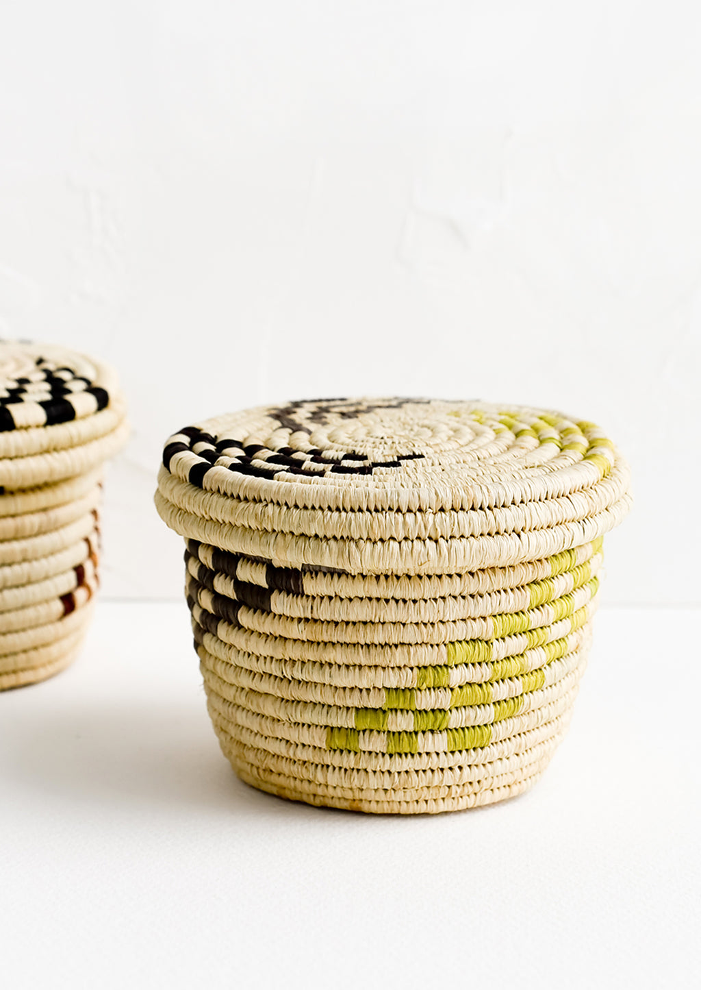 2: Small raffia baskets in woven checker print.