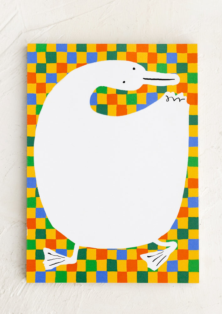 A primary color checker print notepad with duck shape as writing space.