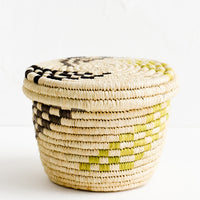 1: A small raffia lidded basket with woven checkered pattern.