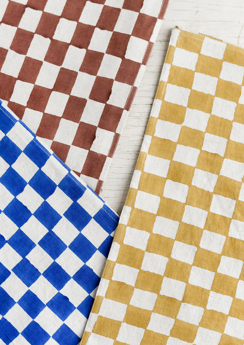 2: Checker patterned table runners in three colors.