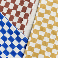 2: Checker patterned table runners in three colors.