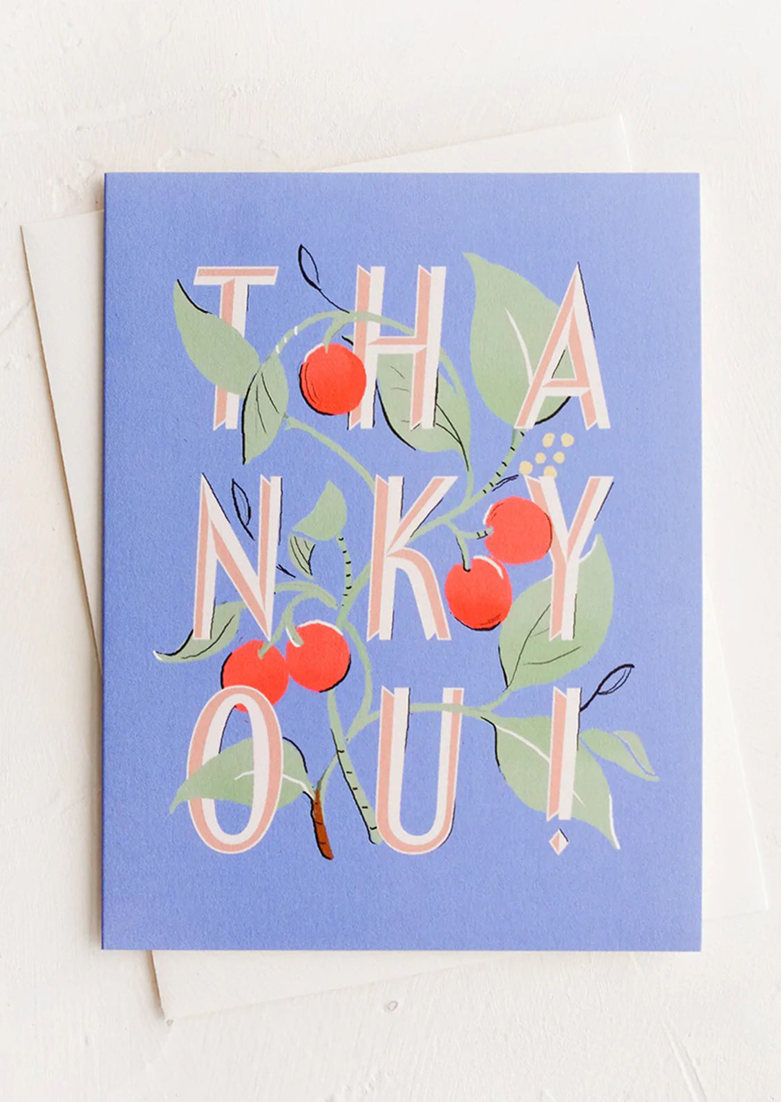 A blue greeting card with "THANK YOU!" intertwined with cherries.