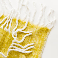 Preserved Lemon: Plush and wooly yellow throw blanket with exaggerated fringe trim in ivory