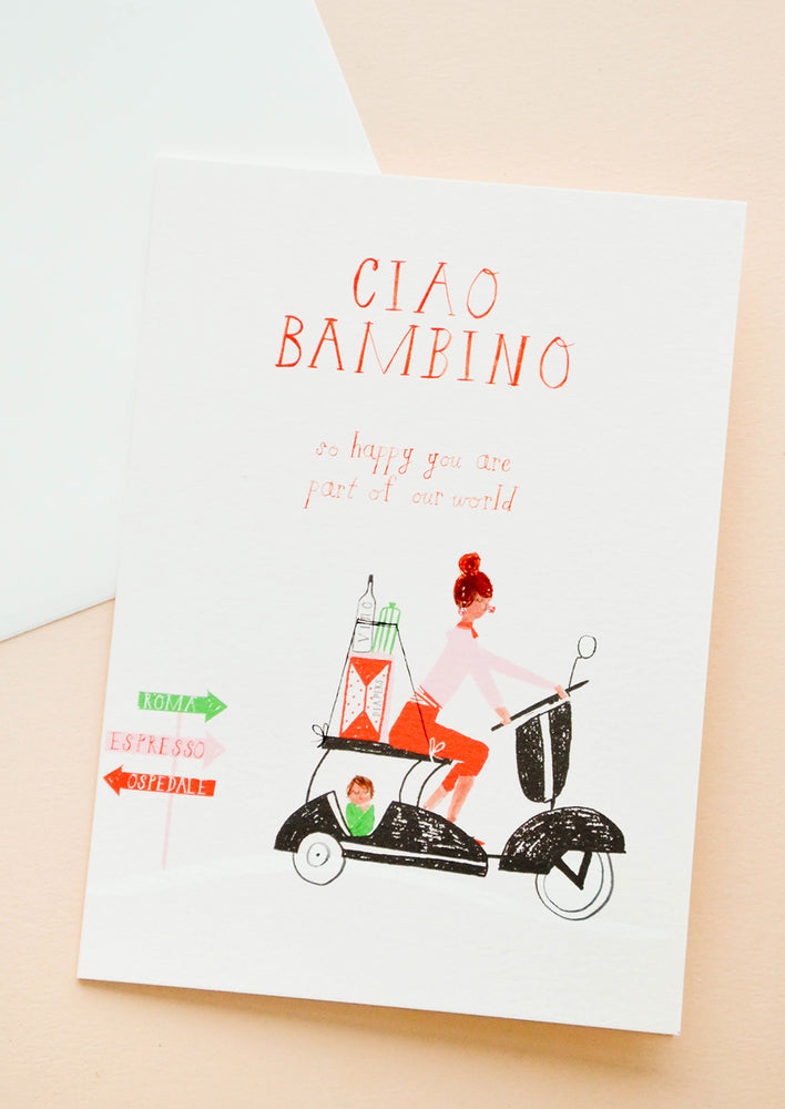 1: Greeting card with woman in Italy on a vespa carting baby supplies in the back