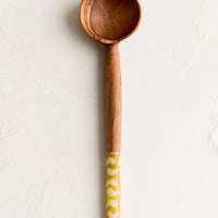 Ochre Batik: An olivewood coffee scoop with gold and white printed bone handle.