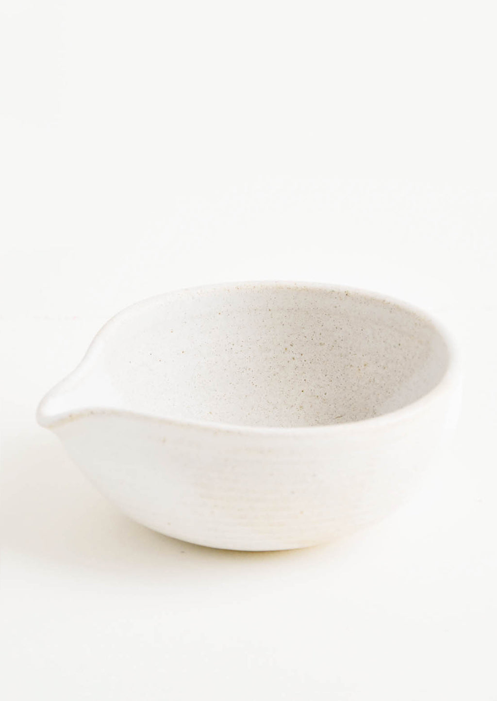 Warm White: An ivory spouted ceramic bowl.