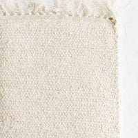 Natural: A textured cotton rug in natural undyed.
