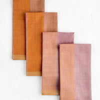 Jam Multi: Four fabric napkins in purple and orange colorblock design.