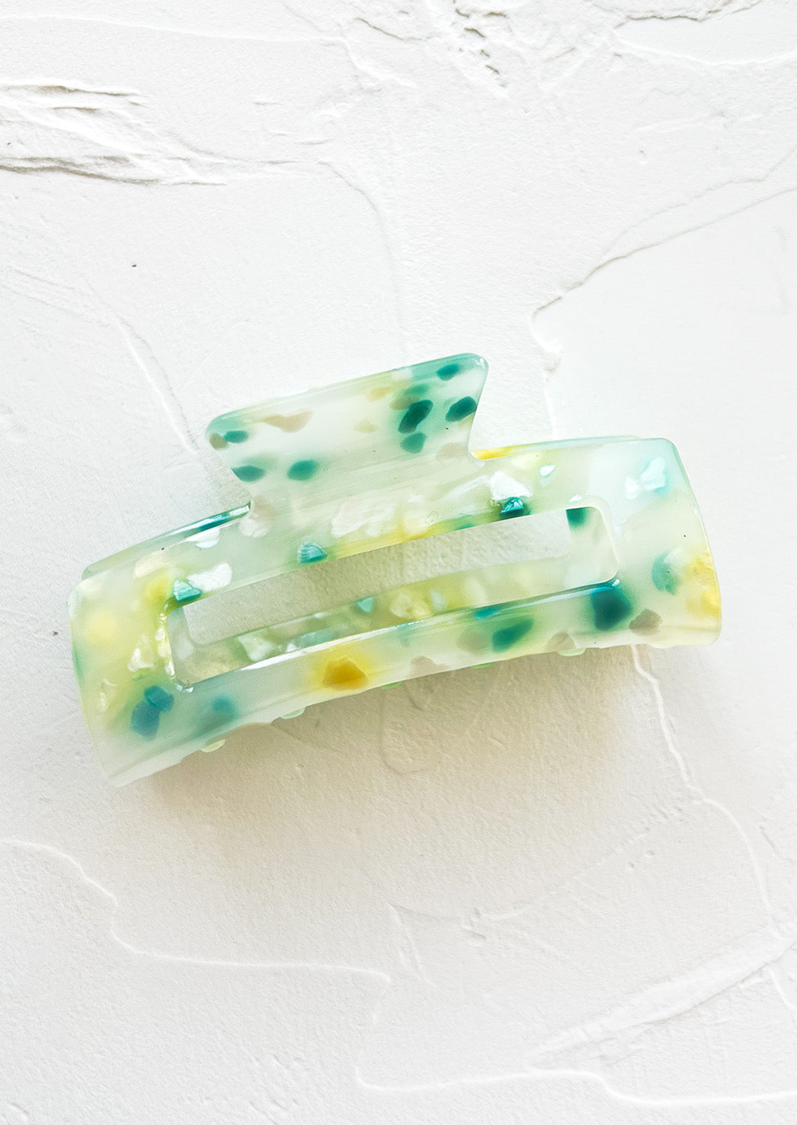 A color fleck hair claw in blue and green multi.