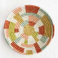 Large: A large woven sweetgrass bowl in white with multicolor geometric design.