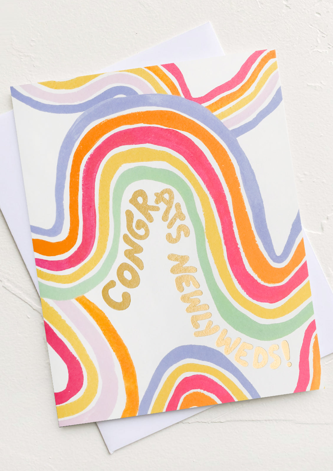 A greeting card with rainbow wave and text reading "Congrats newlyweds!"