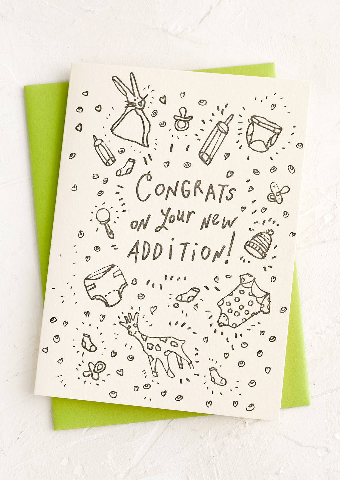 A card with icons of baby things and text reading "Congrats on your new addition!".