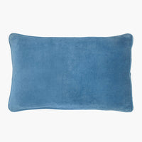 9: A lumbar velvet throw pillow in atlantic blue.