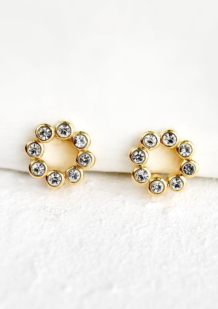 1: A pair of stud earrings in shape of hollow circle made from round crystals.
