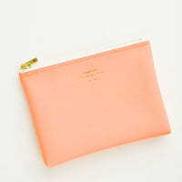 Peach / Small: Small vinyl coin pouch with gold zipper and crosshatch texture, in peach.