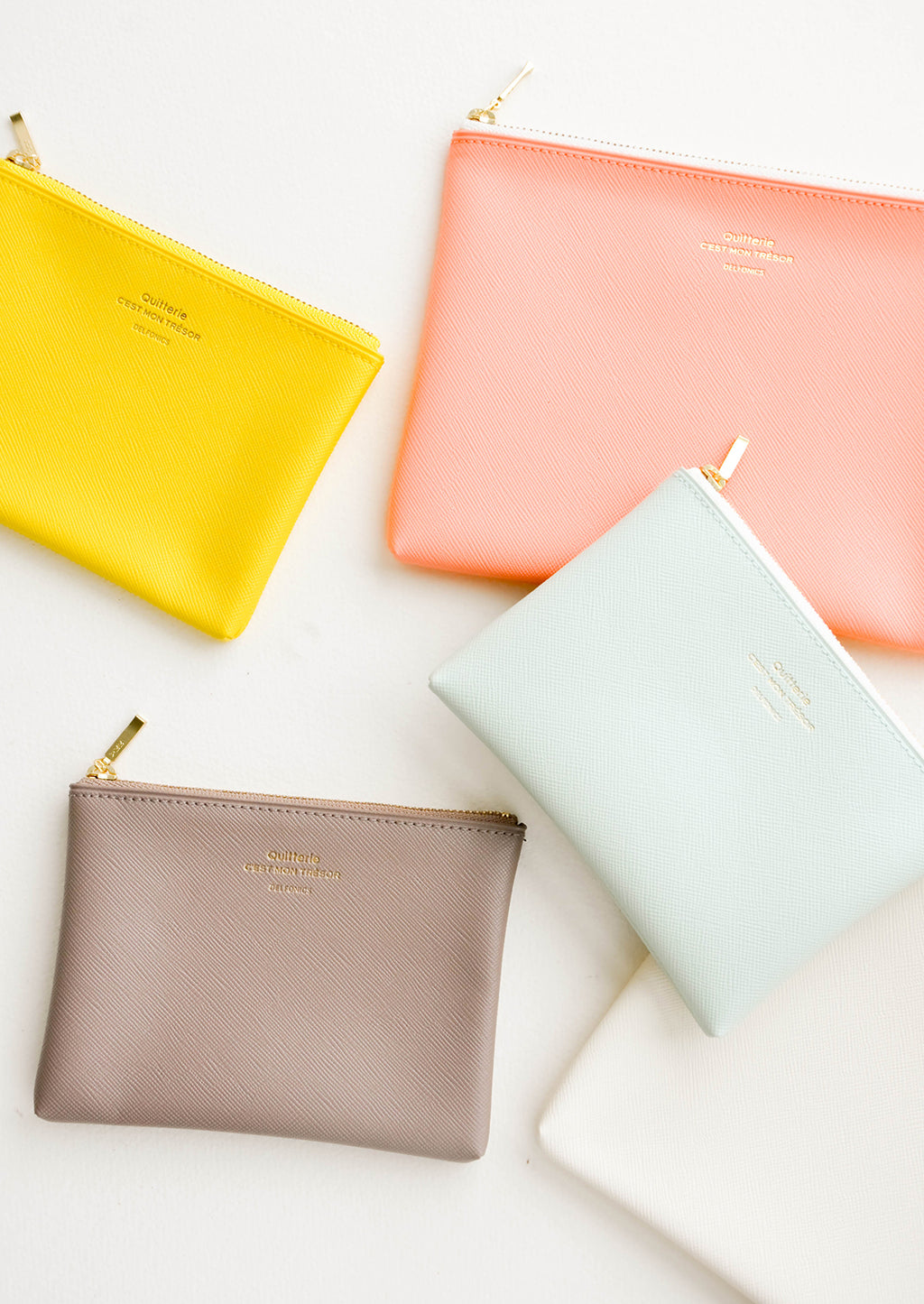 Yellow / Small: Product shot showing multiple styles and colors of pouches.