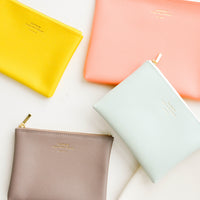 Yellow / Small: Product shot showing multiple styles and colors of pouches.