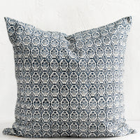 1: A block printed pillow in blue and white tile print.