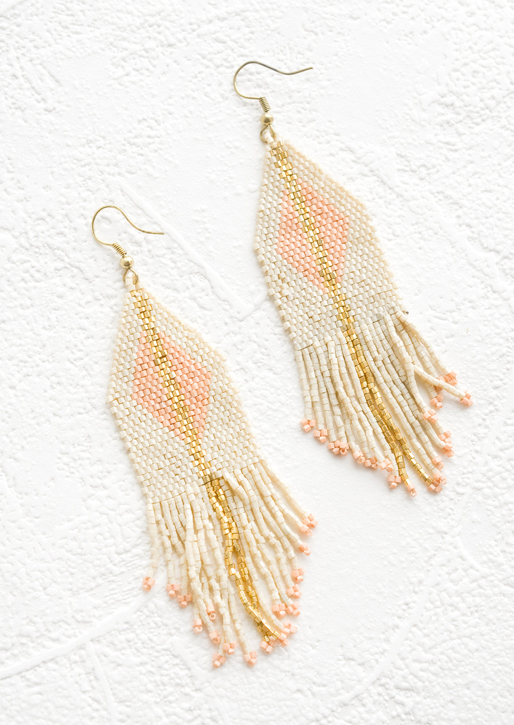 Ivory / Blush / Gold: Beaded earrings with triangular top and fringed bottom, gold stripe and peach triangle at center