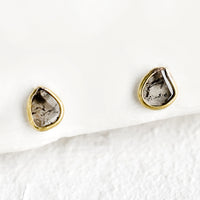1: Organically shaped stud earrings with small diamond slice surrounded by brass metal trim
